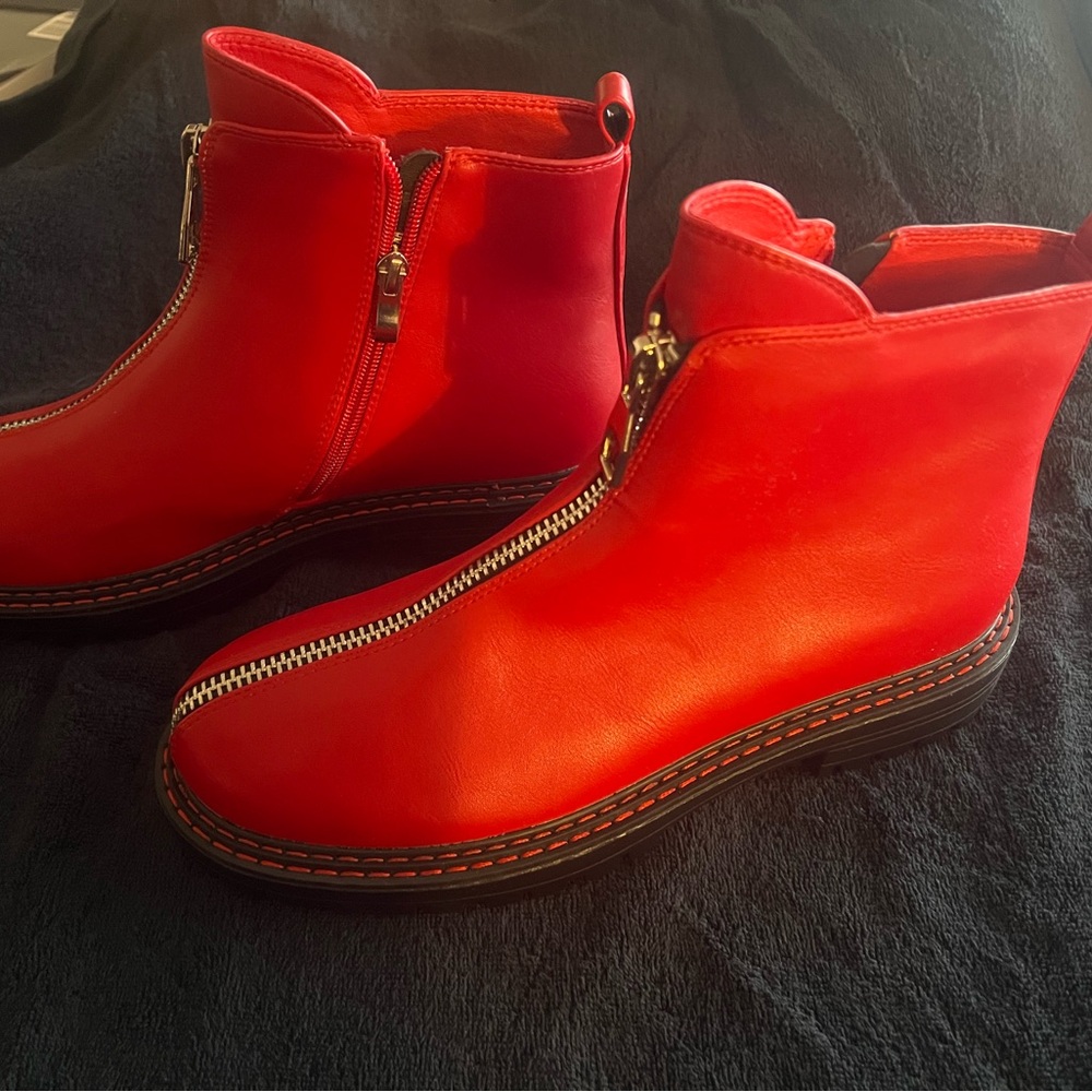 Stylish red booties. Never been worn.